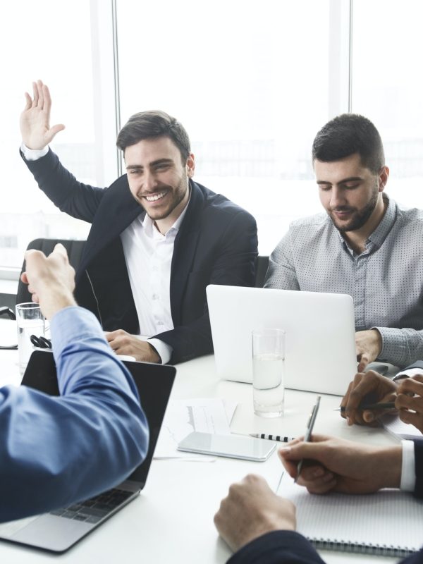 businessman-raising-hand-and-asking-question-at-meeting.jpg